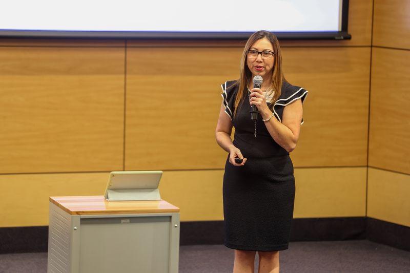 woman speaking into microphone